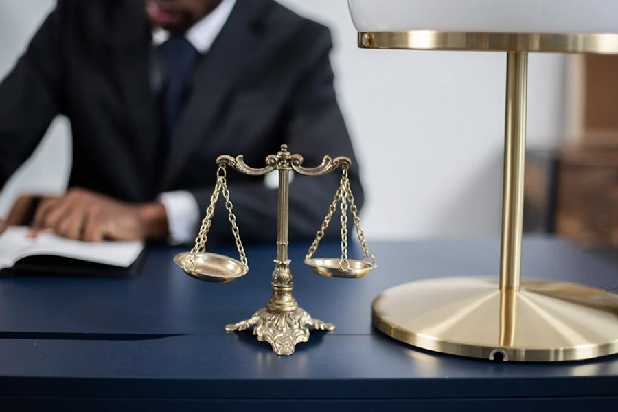 A scale figurine on a lawyer's desk